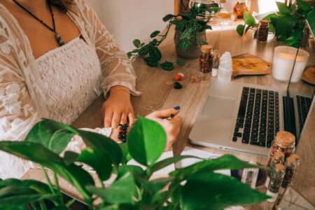 Employees sitting in meditation pose during corporate wellness session in modern office space