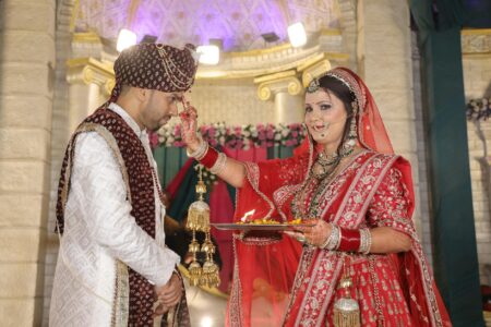 How Video Game Soundtracks Are Replacing Pop Music at Wedding Receptions Elegant wedding ceremony with bride and groom at altar surrounded by guests in formal setting