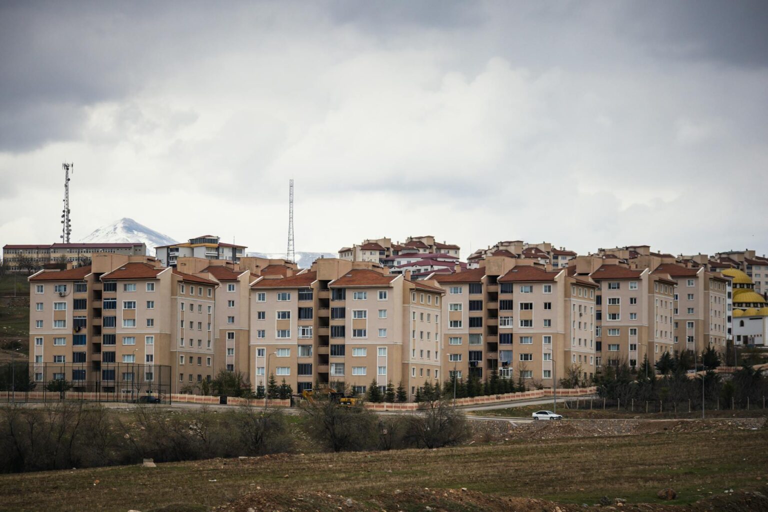 Inside the Growing Trend of Multi-Generational Co-Living Communities Contemporary multi-unit housing development with shared outdoor spaces