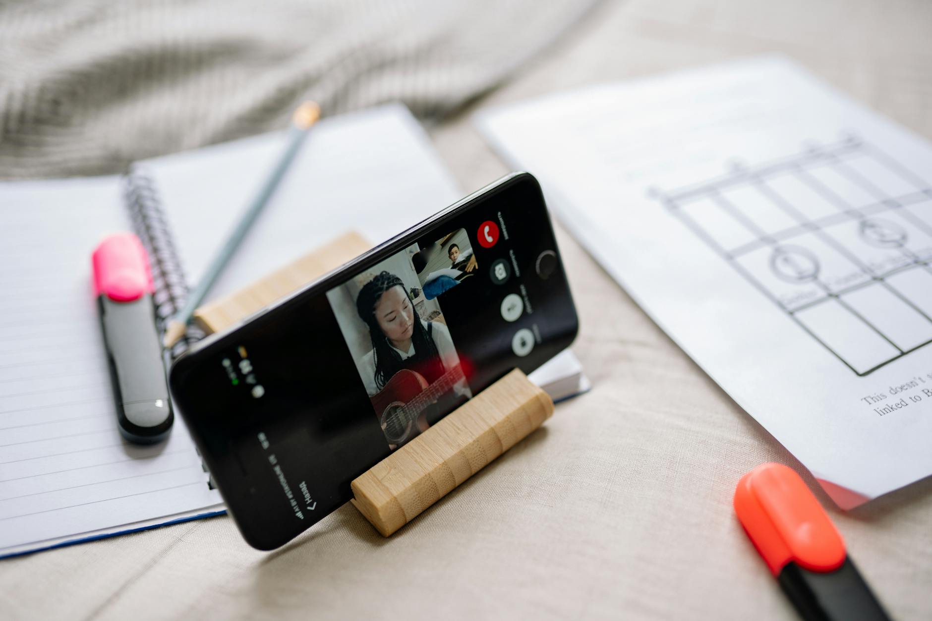 Person using language learning app on smartphone with colorful interface