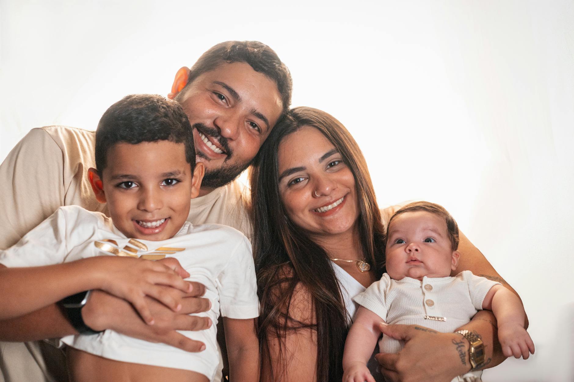 Professional photographer taking pictures of a family in a bright, modern home setting