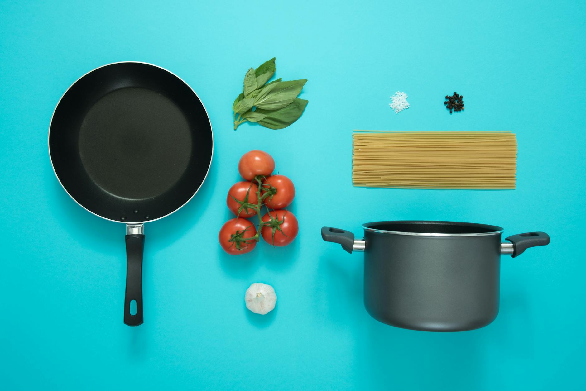Fresh ingredients and recipe cards laid out on a kitchen counter from a meal kit delivery service
