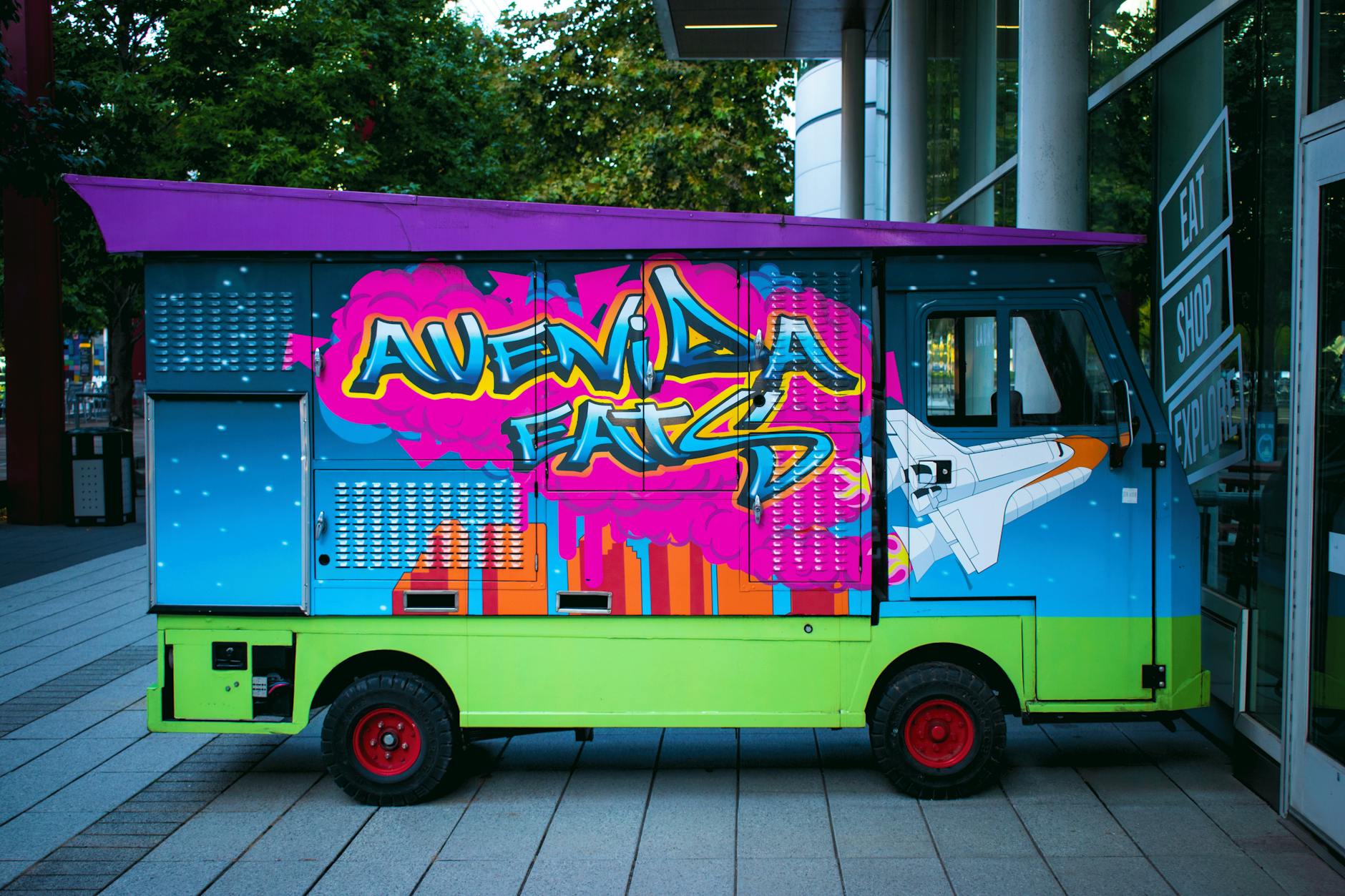 Colorful food truck with artistic exterior design and vibrant murals