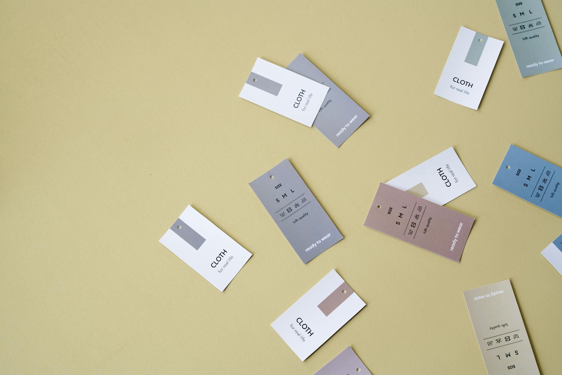Clothing labels and tags showing brand information and care instructions