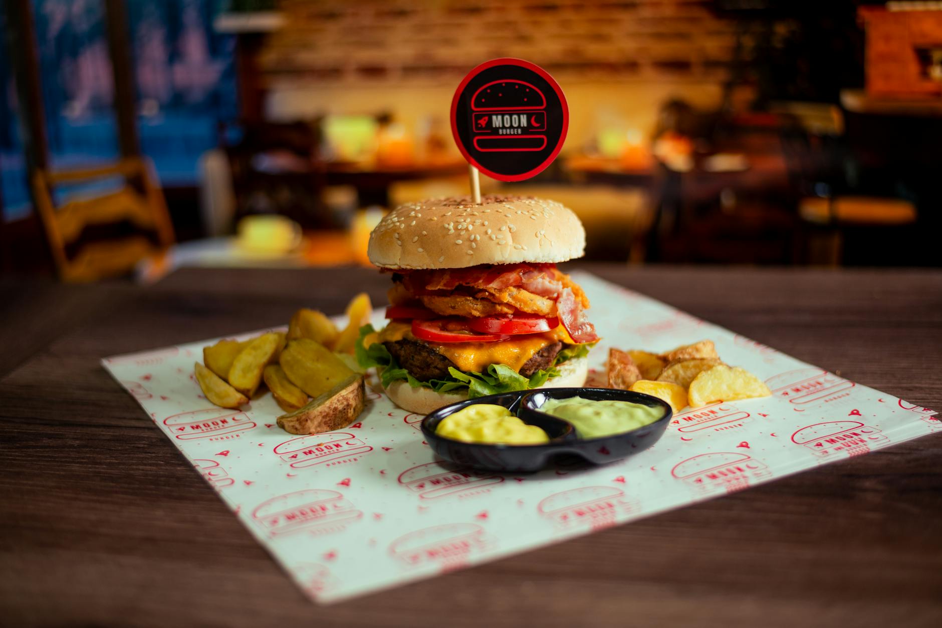 Artfully plated gourmet burger with premium ingredients and garnishes