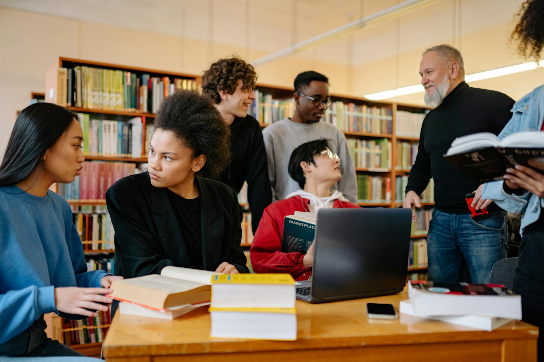 Diverse group of people sitting in circle discussing books
