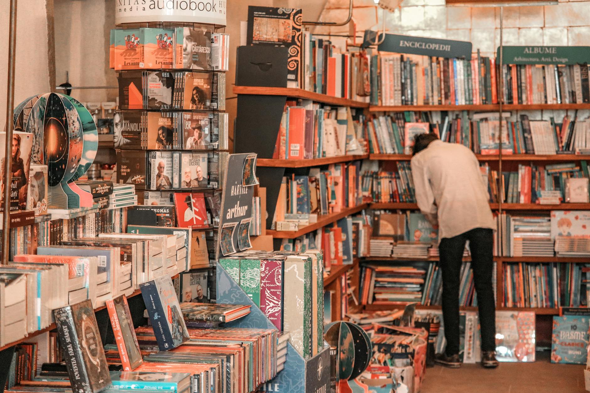 Modern bookstore interior with well-lit shelves displaying books with attractive cover designs