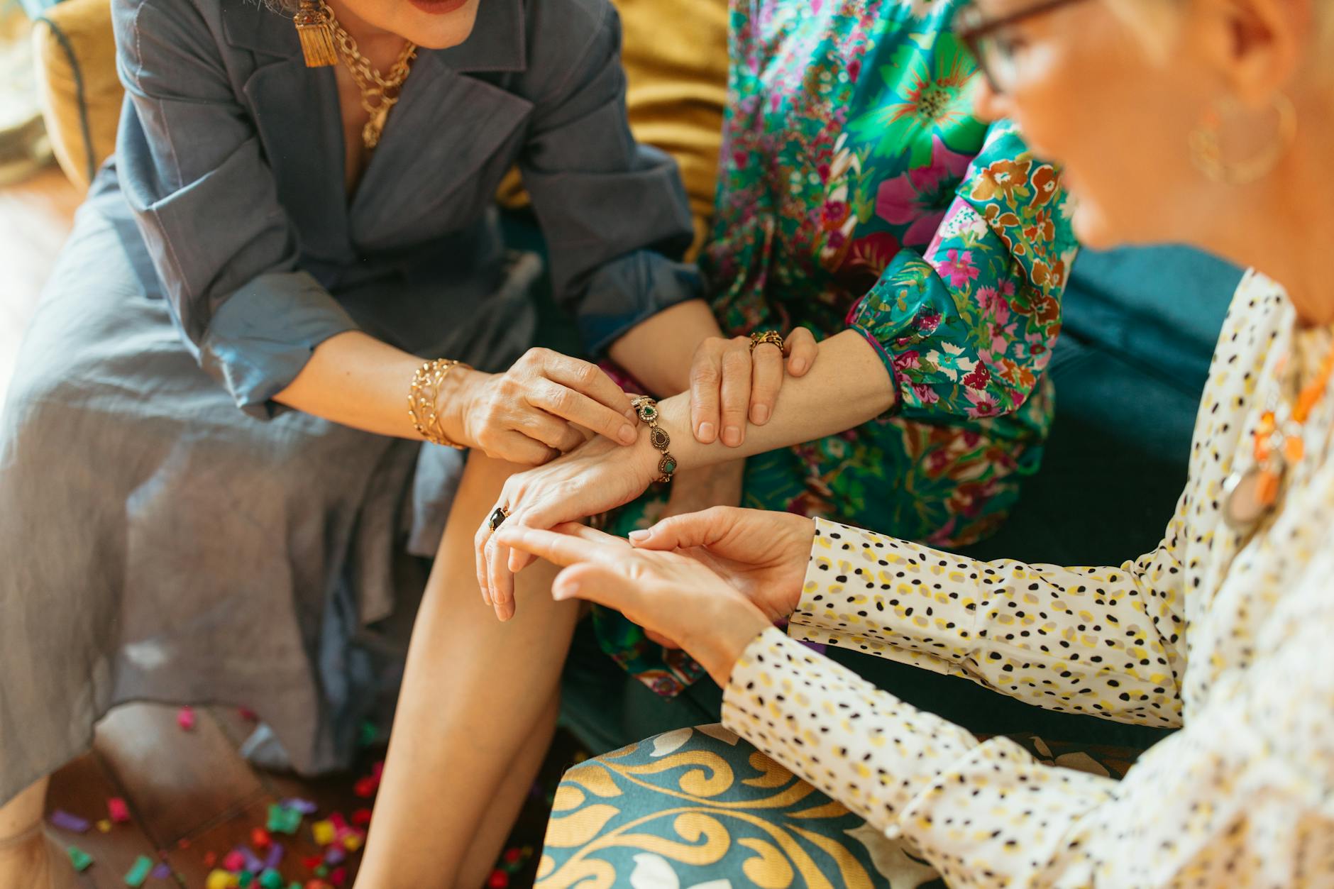 Hands making colorful friendship bracelets during craft activity