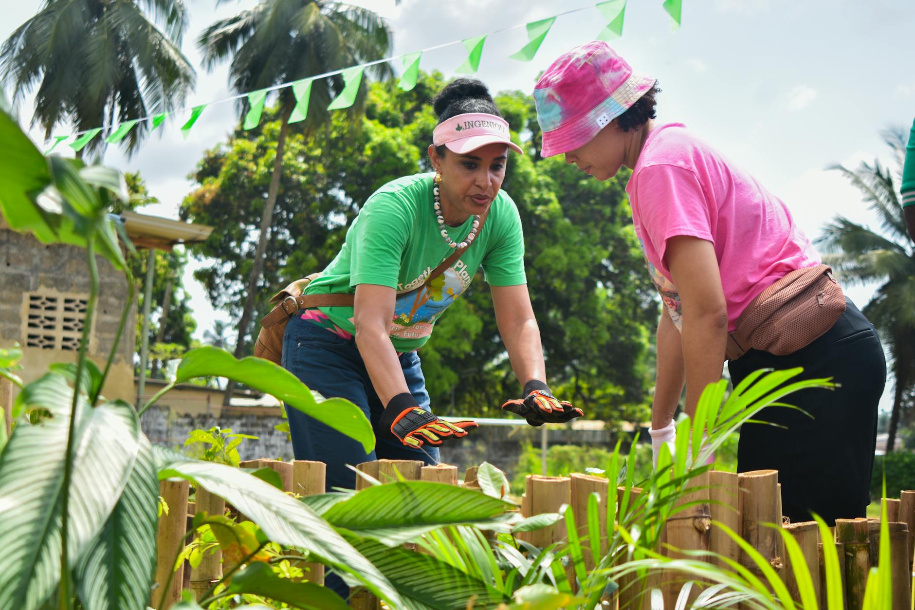 People of different ages working together in a shared community garden space