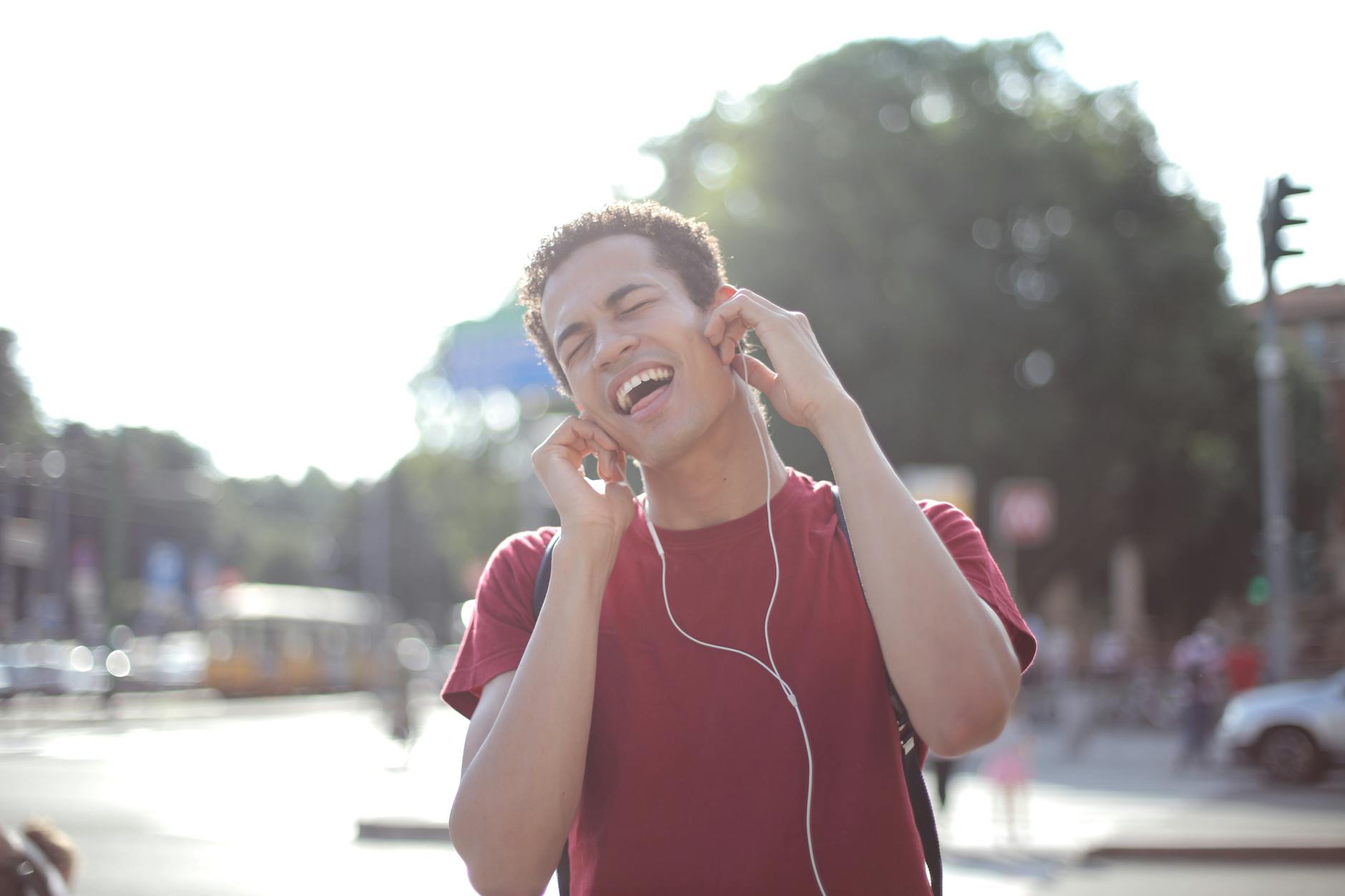 Group of young adults sitting in circle listening attentively to music