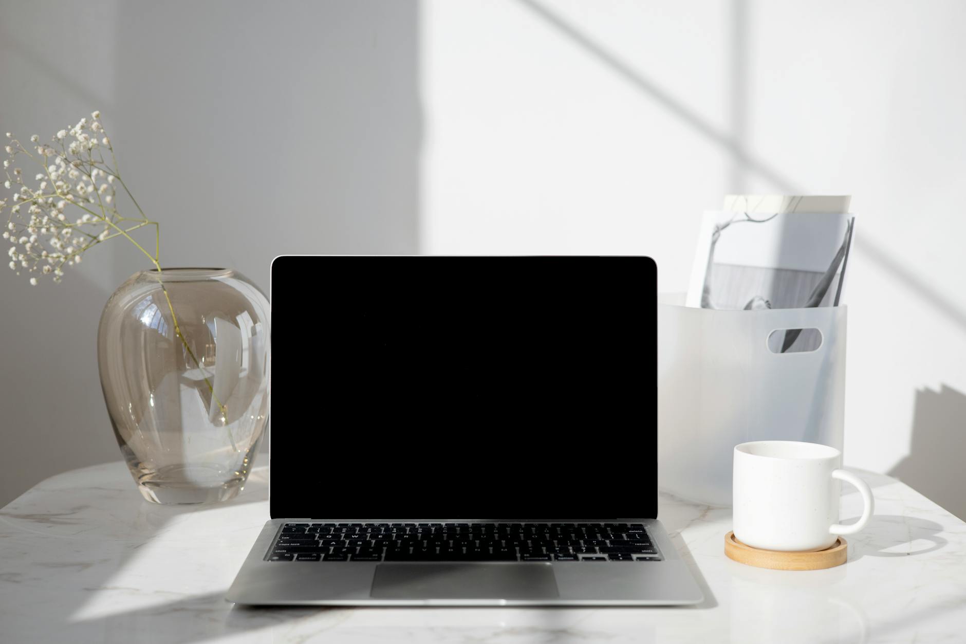 Clean minimal laptop workspace setup for digital nomad productivity