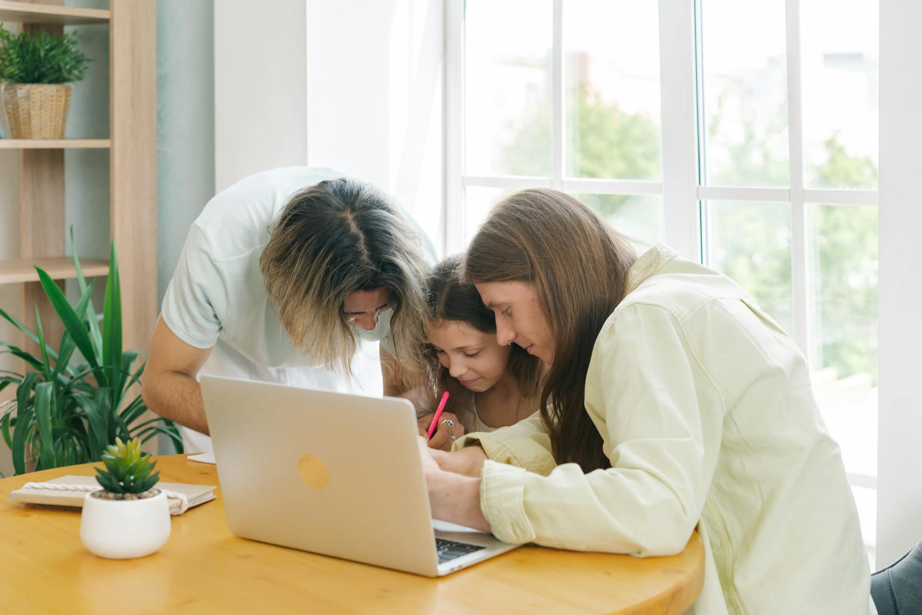 Multi-generational family members collaborating on a challenge together indoors
