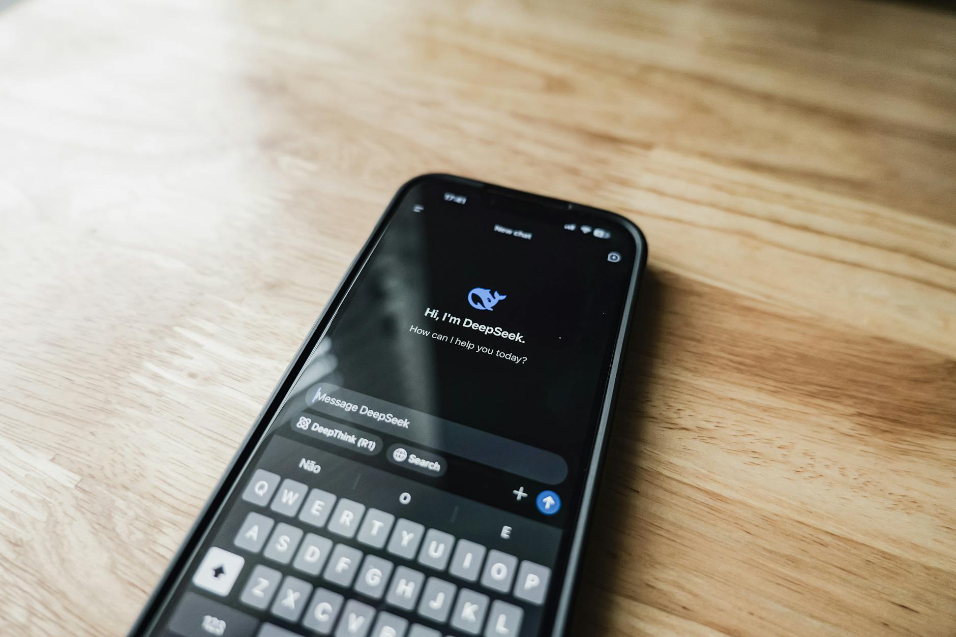 Close-up view of smartphone screen displaying multiple app notifications and messages
