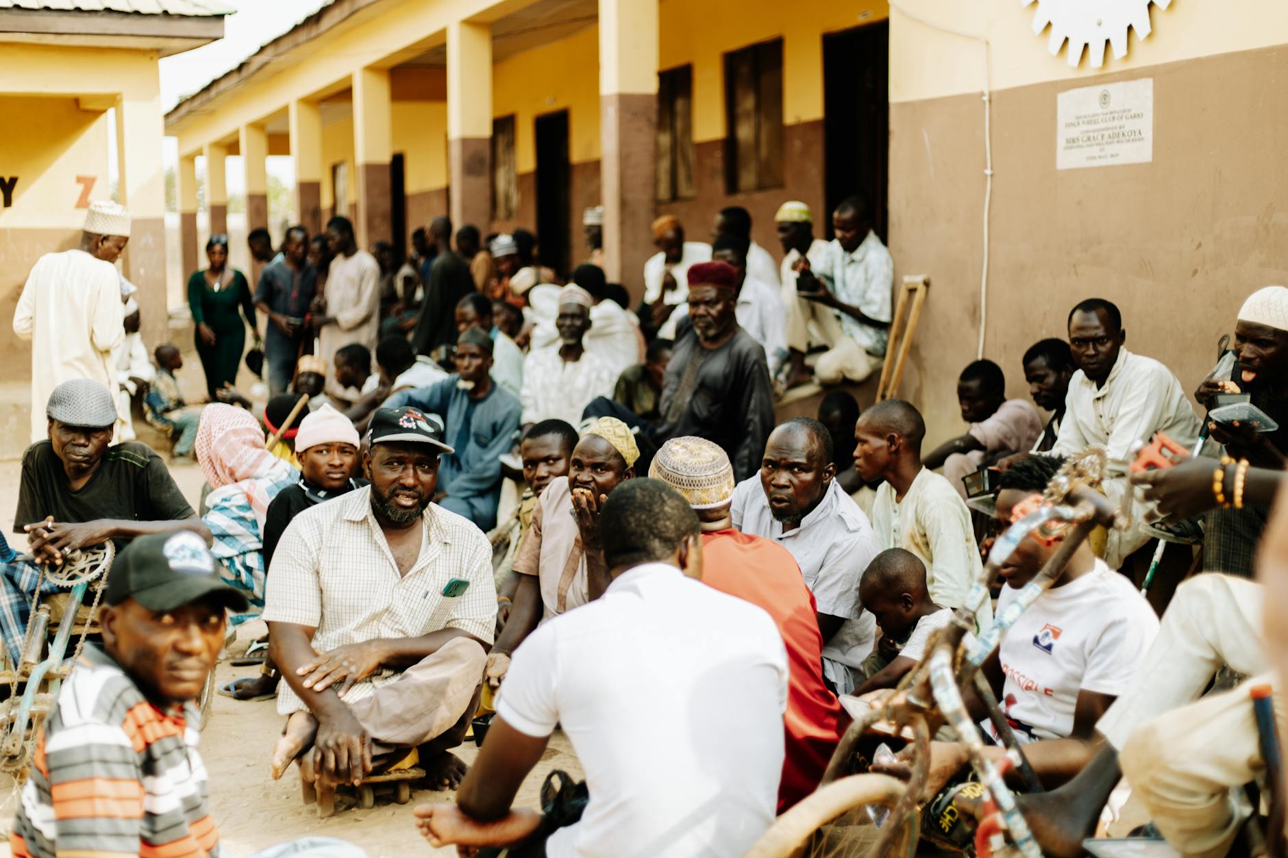 People gathering for community discussion in library setting