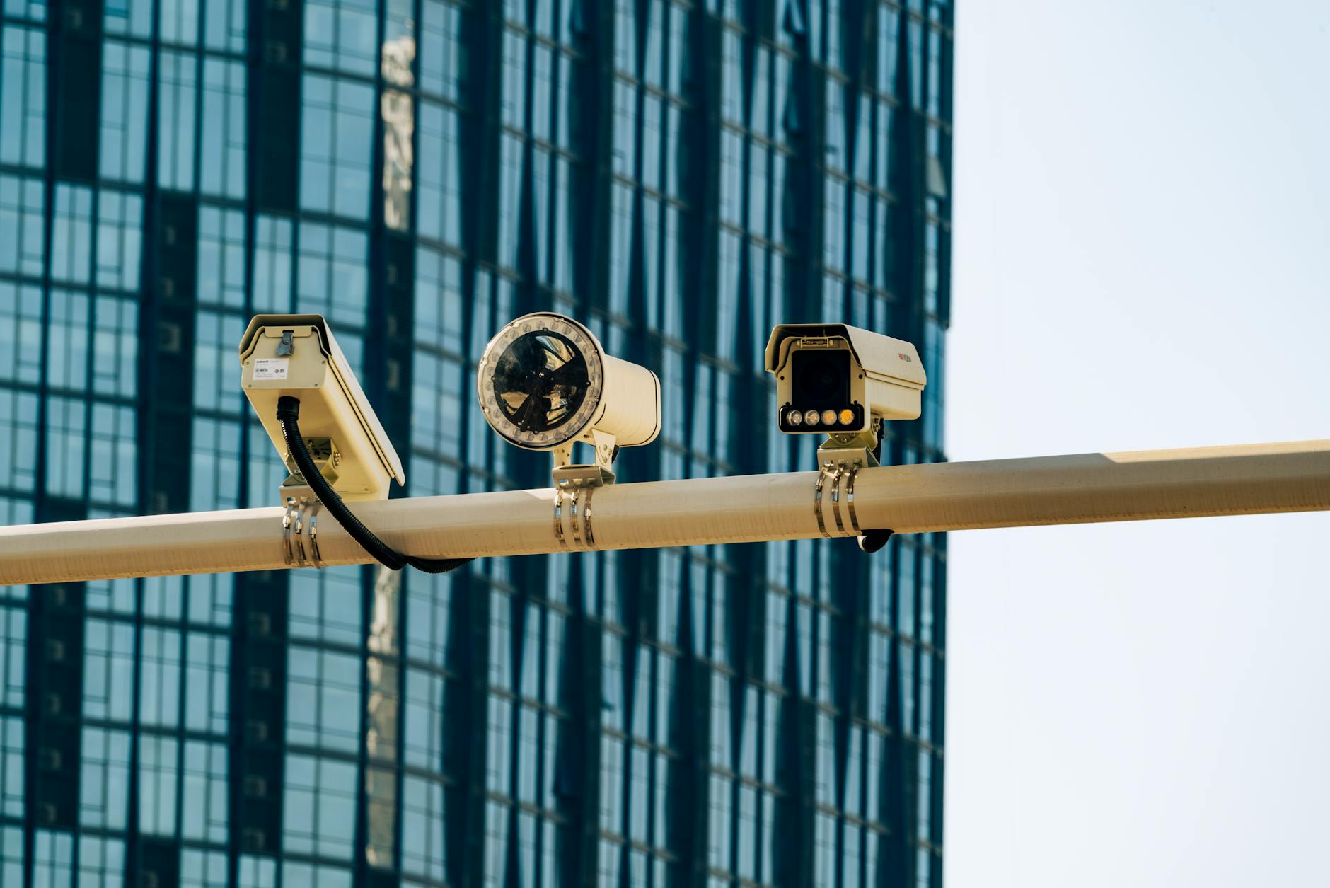 Security camera mounted on office ceiling monitoring workplace environment
