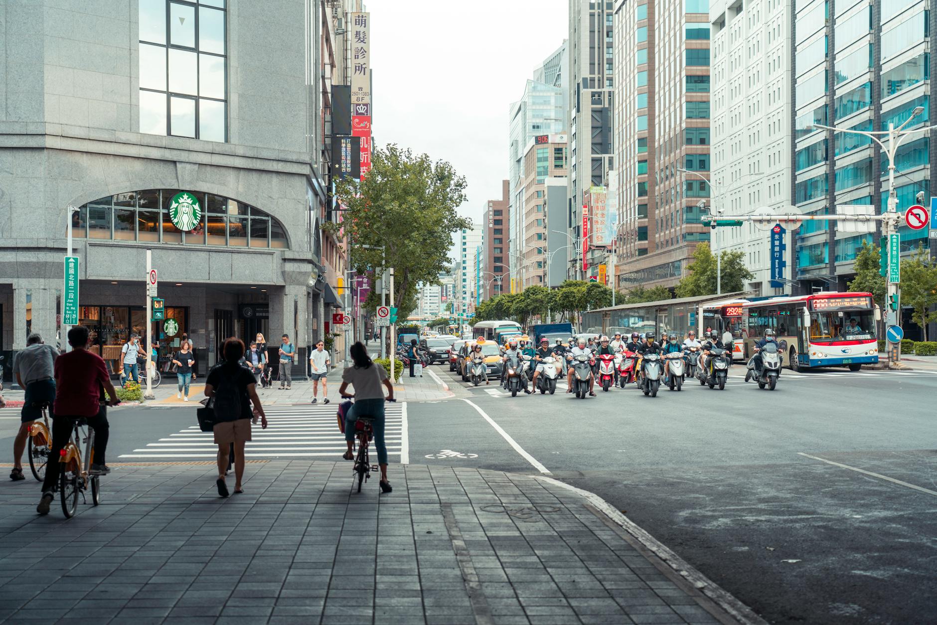 Busy urban street scene with restaurants and pedestrians in a metropolitan area