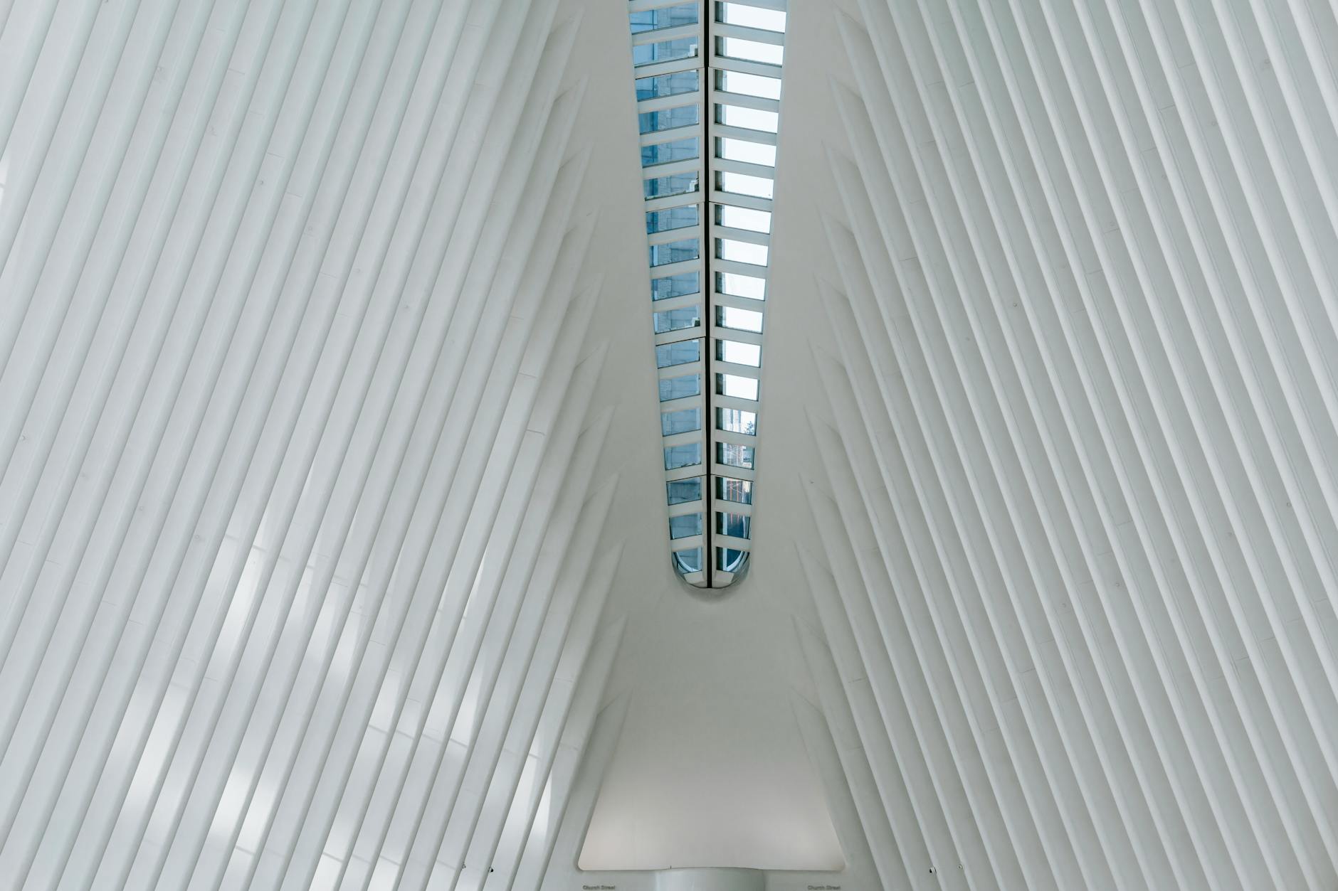 Detailed architectural drawings and blueprints spread across a drafting table