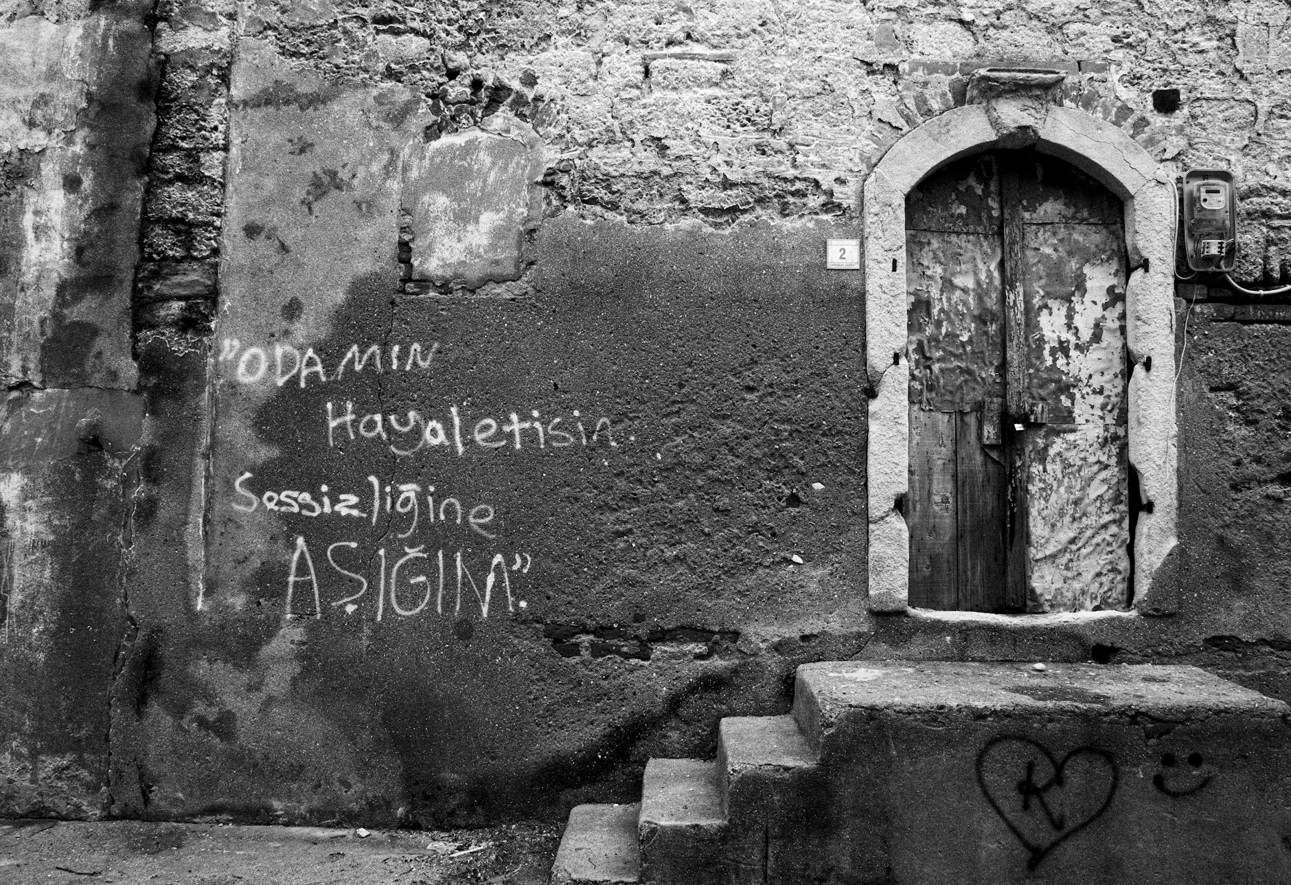 Businessman in suit looking overwhelmed while working late at office desk
