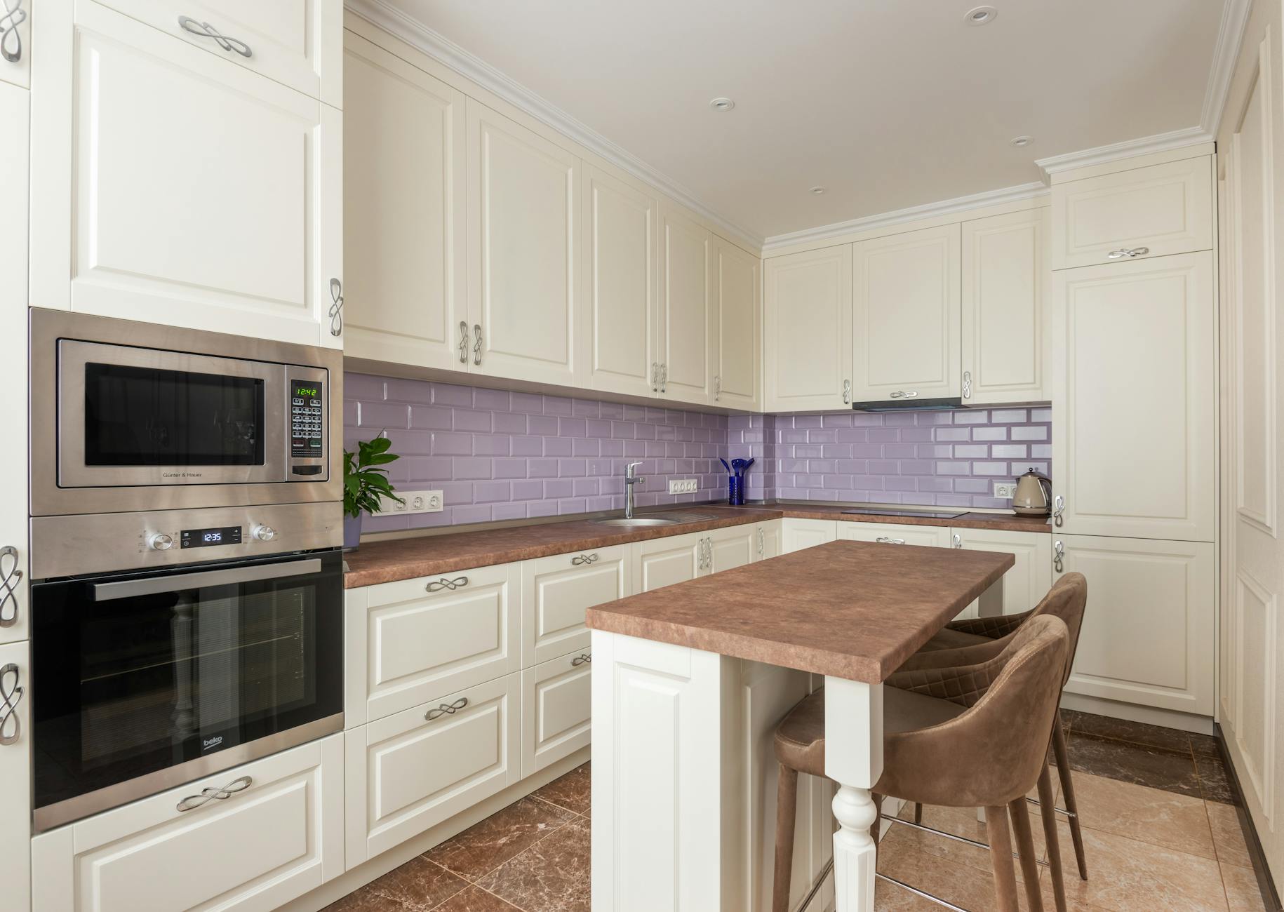 Modern luxury kitchen with marble countertops and high-end appliances