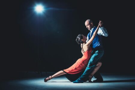 Ciara Miller Joins Dancing With the Stars After Summer House Drama Professional ballroom dancers performing in elegant costumes on stage