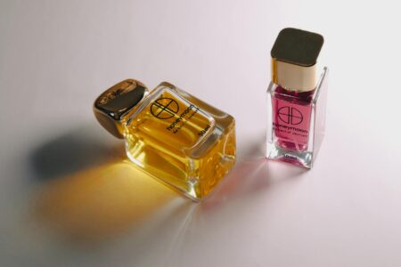 Elegant perfume bottles arranged on a reflective surface