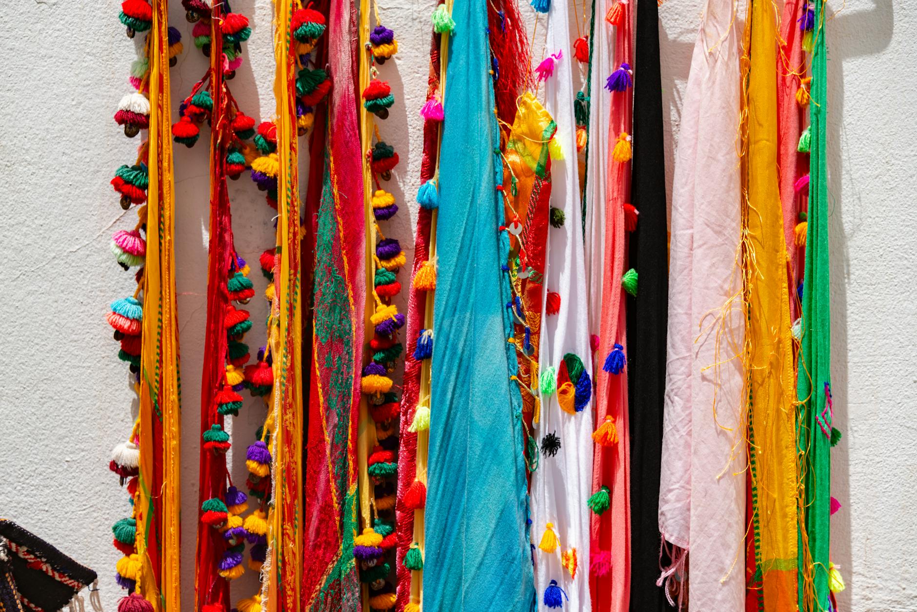 Colorful bikinis displayed on hangers showing variety of swimwear styles