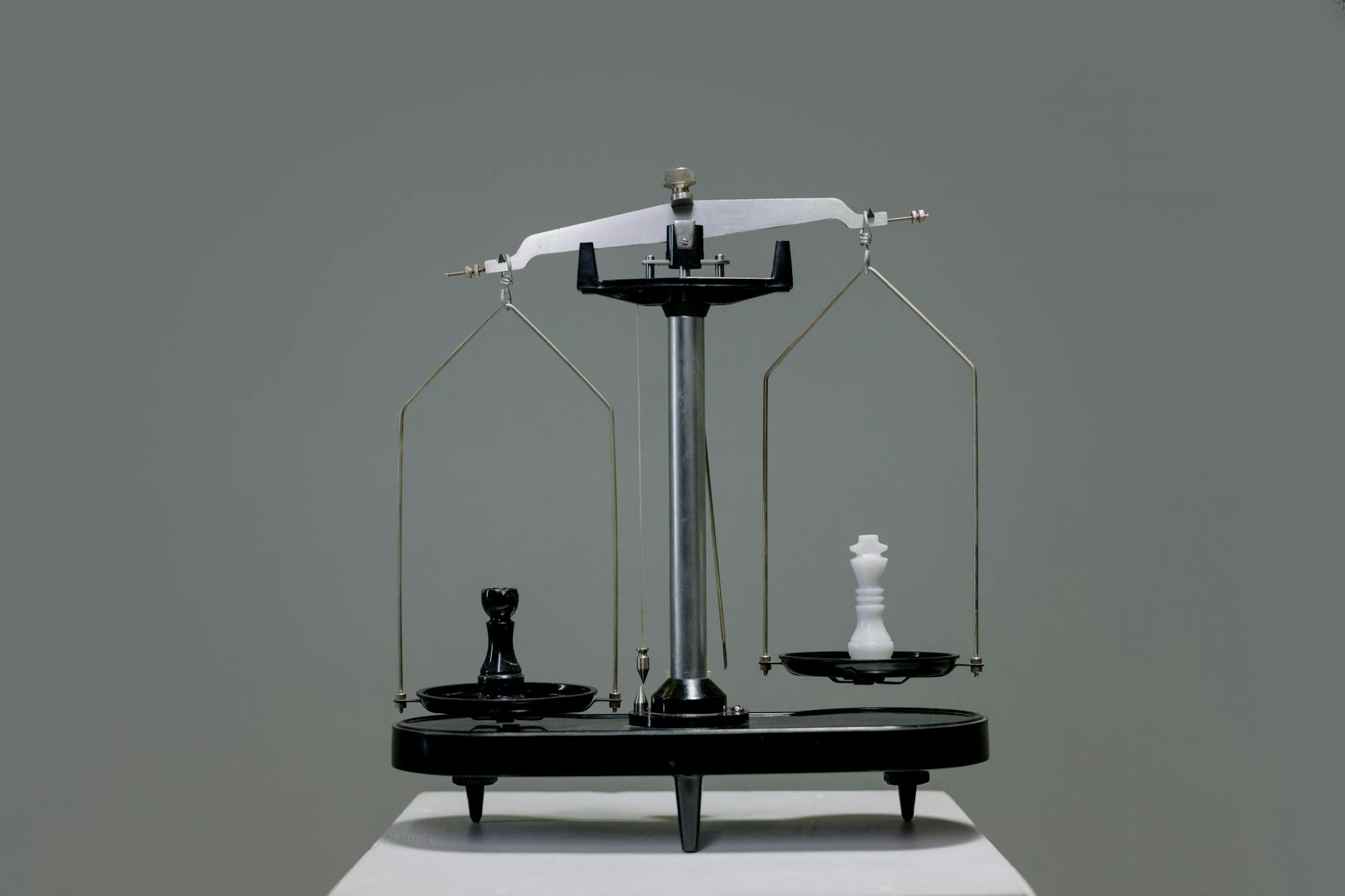 Vintage brass scales balanced on wooden surface representing Libra's quest for equilibrium