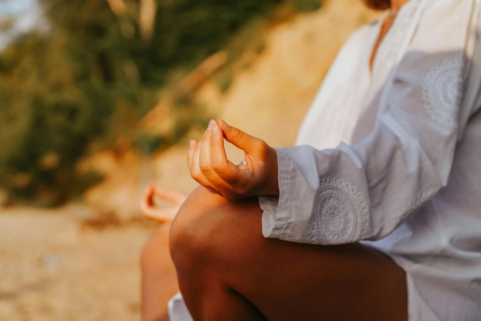 Person sitting peacefully in meditation pose