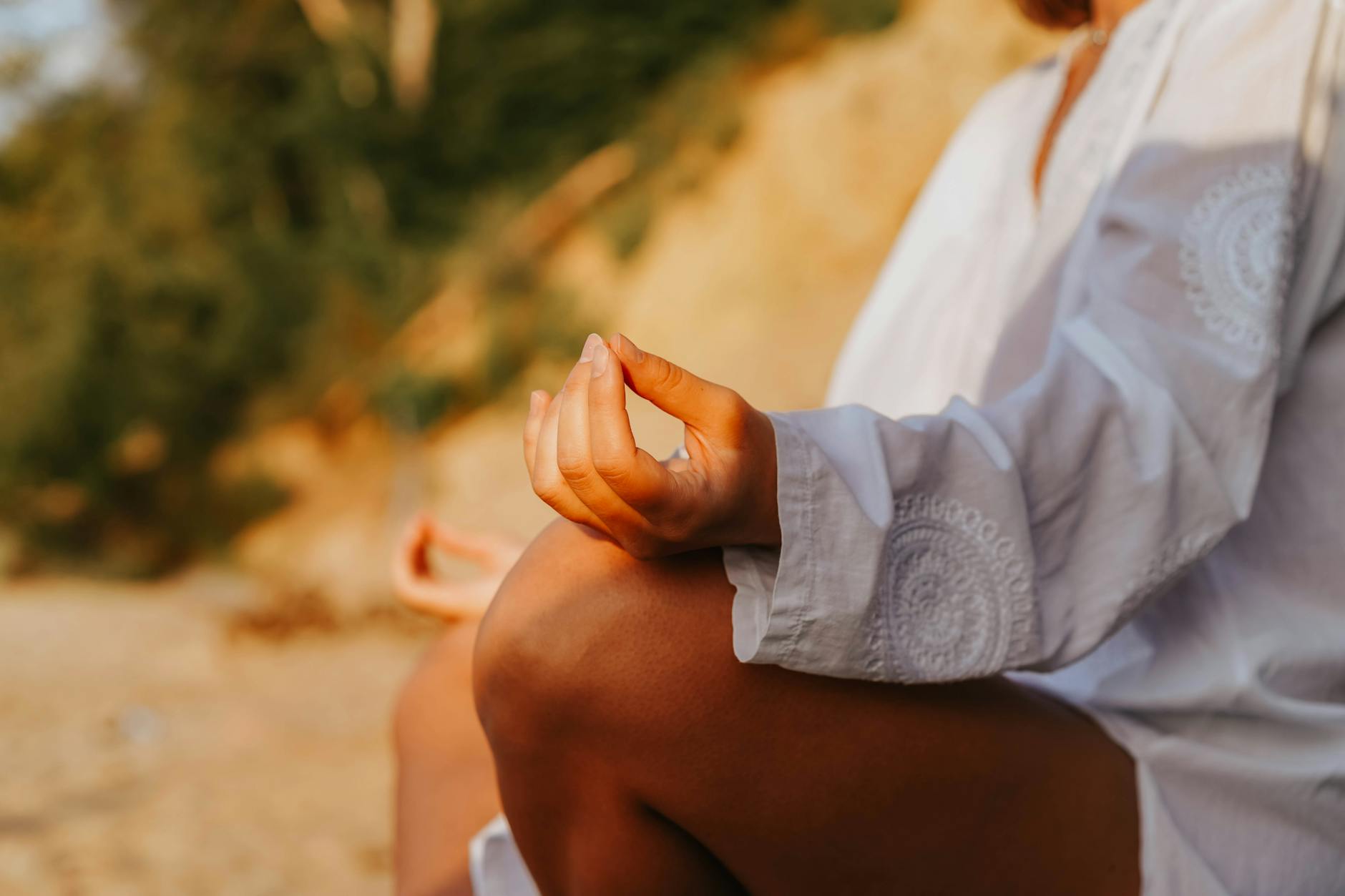 Person sitting peacefully in meditation pose