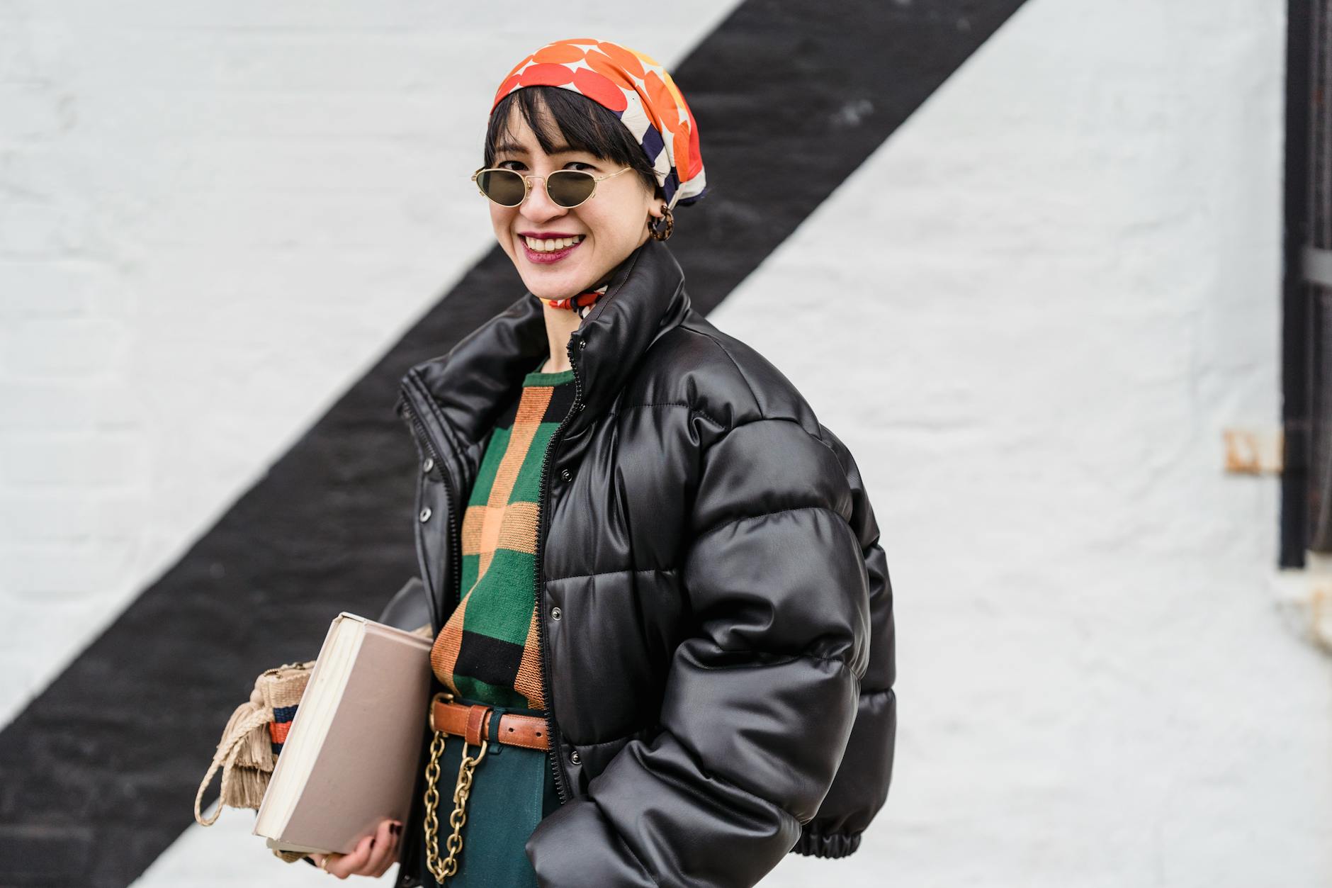 Person wearing lightweight jacket in spring weather
