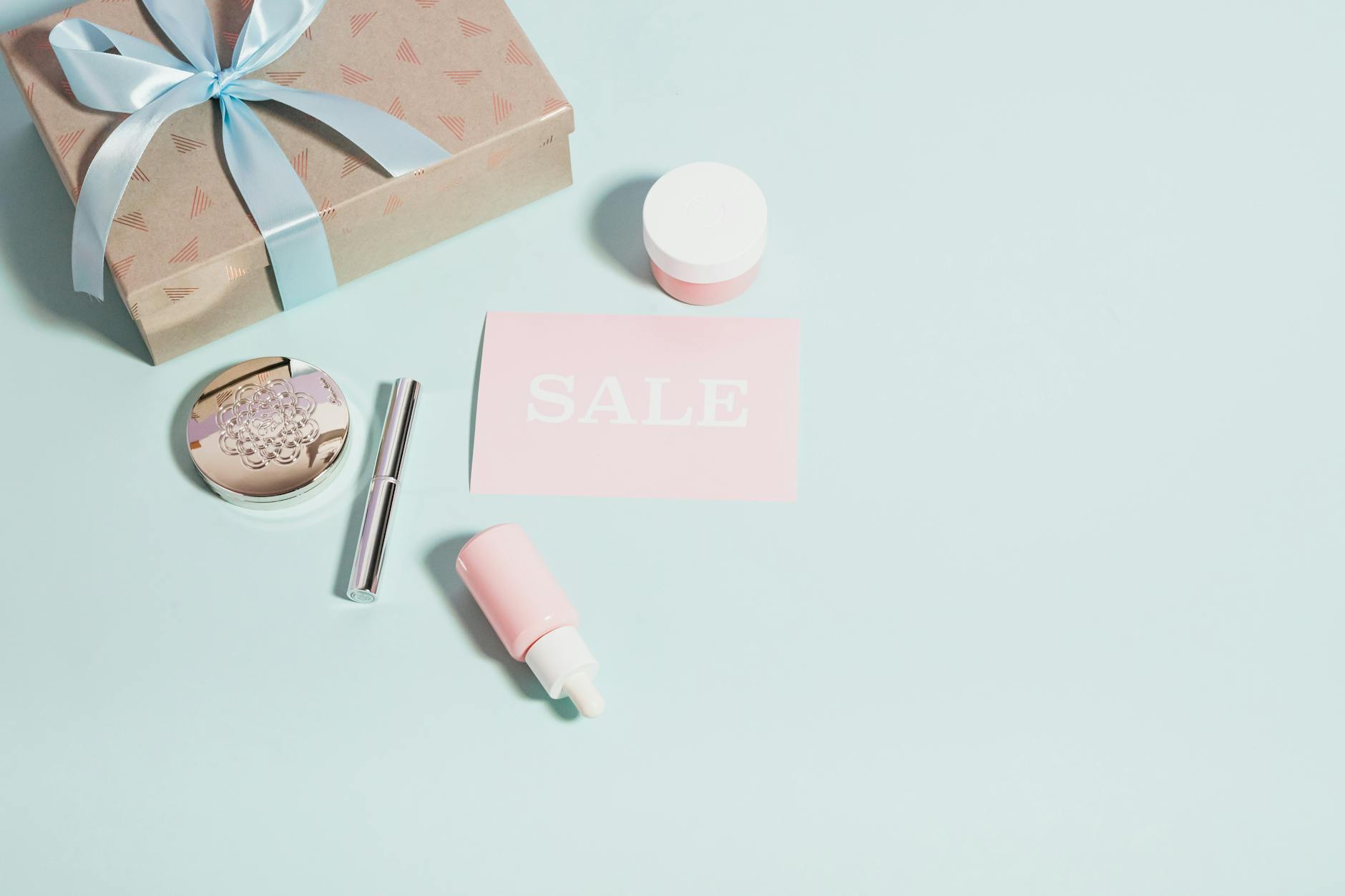 Colorful makeup and cosmetic products displayed with sale tags