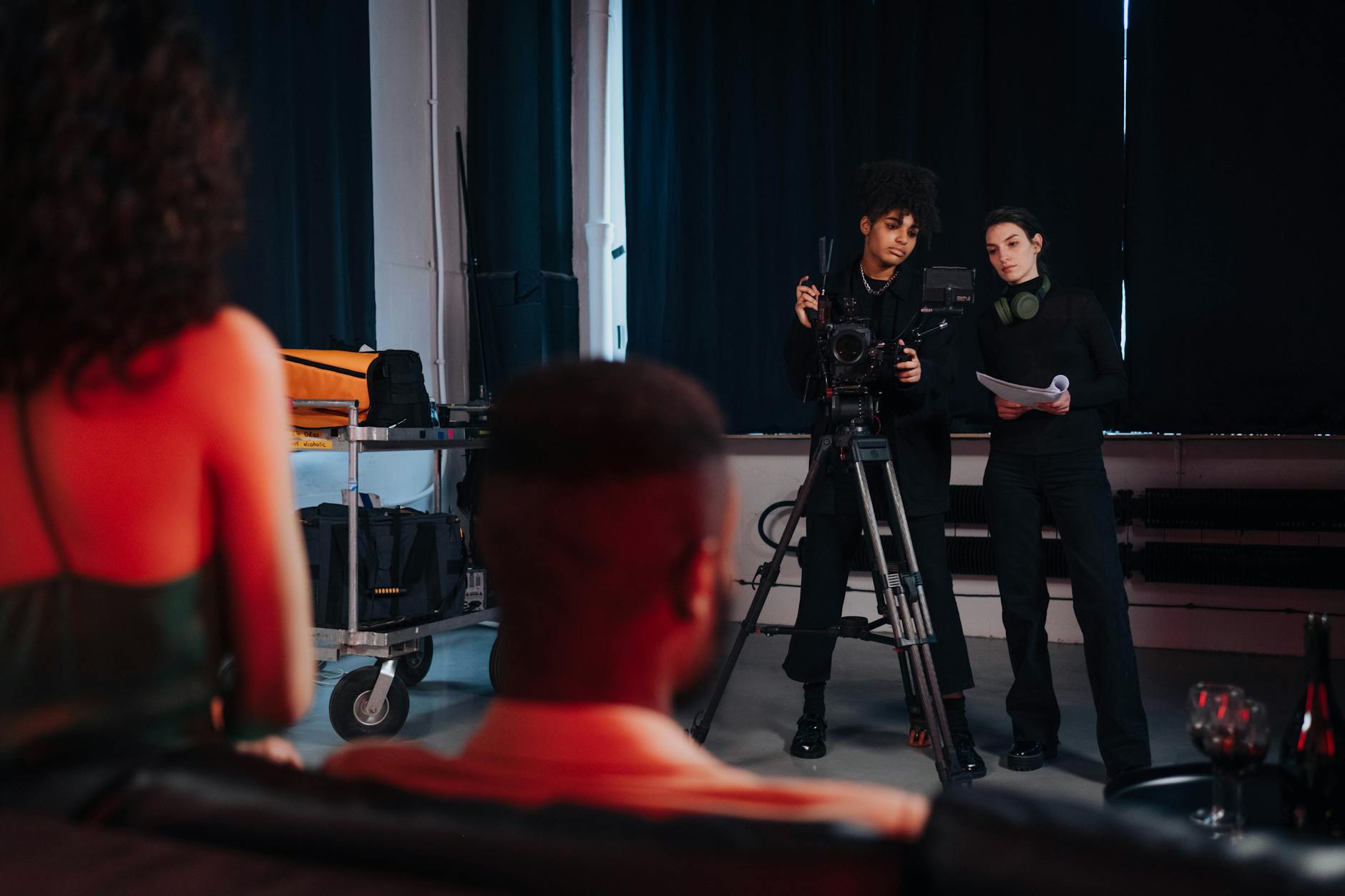 Television production crew working with cameras and equipment on location