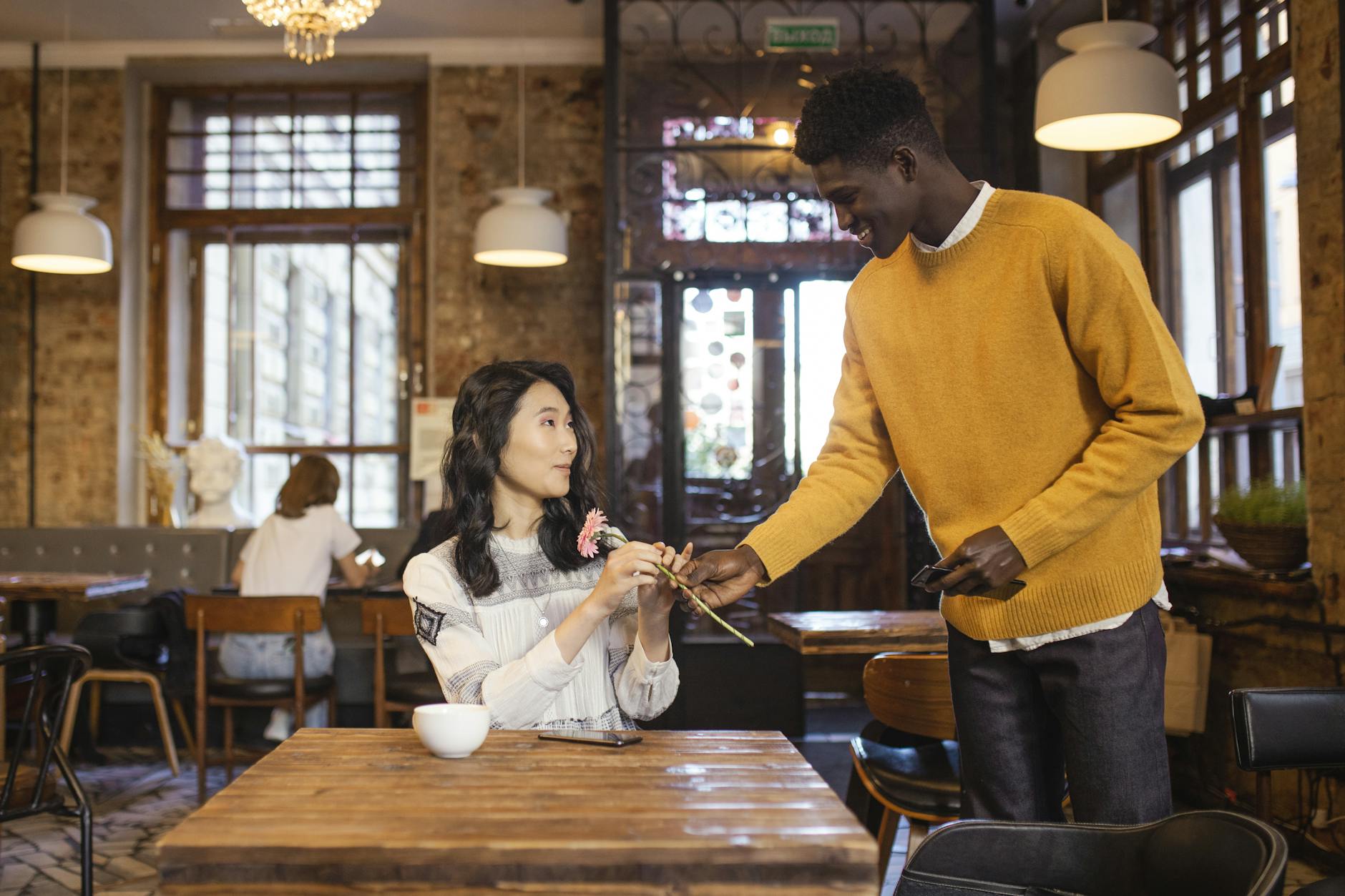 Woman smiling during coffee date conversation