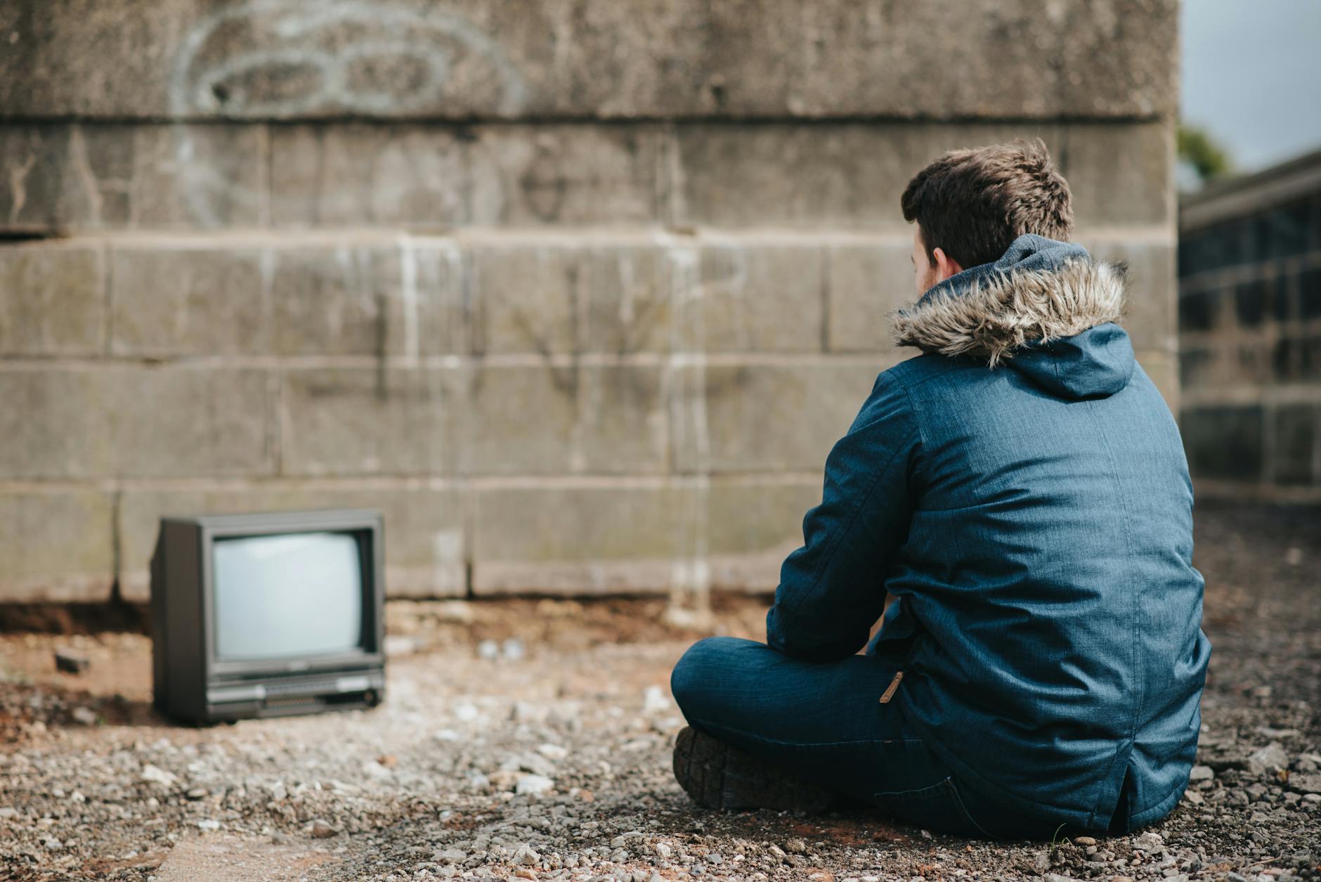 Person watching television in dimly lit room