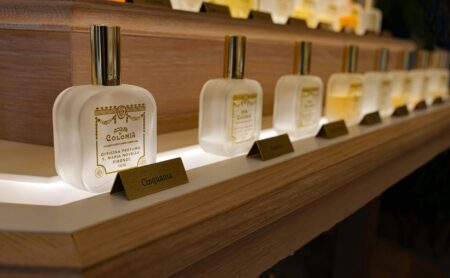 From Smoky Florals To Tropical Mango: 7 New Fragrances To Shop In May Collection of various perfume bottles arranged on a clean surface
