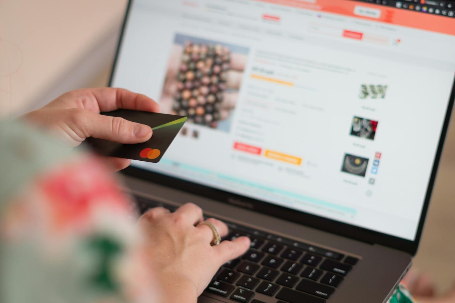 April Shopping Patterns Expose Consumer Priorities Amid Economic Shifts Person browsing products on laptop screen showing various retail websites