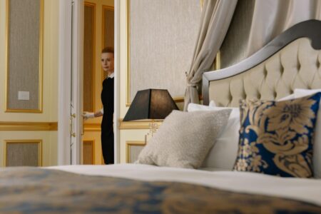 Upscale hotel room with welcome amenities and branded merchandise