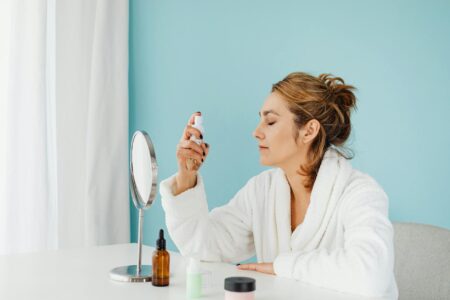 Woman applying eye cream during skincare routine
