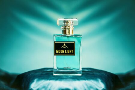 Elegant perfume bottles arranged on a marble surface with soft lighting