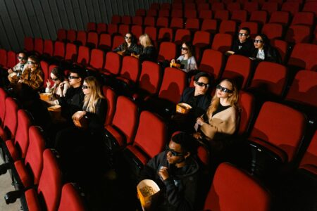 Dark movie theater with illuminated screen