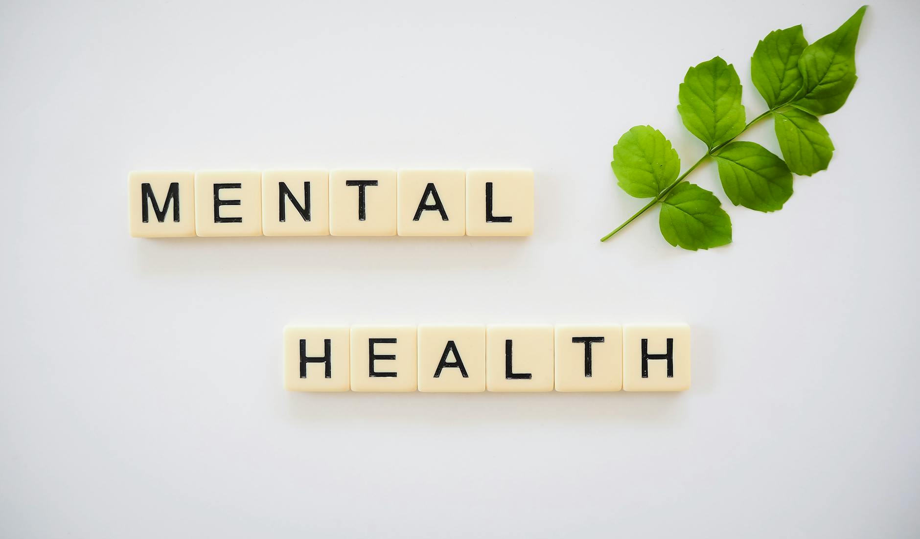 Person wearing casual t-shirt representing mental health awareness and self-acceptance