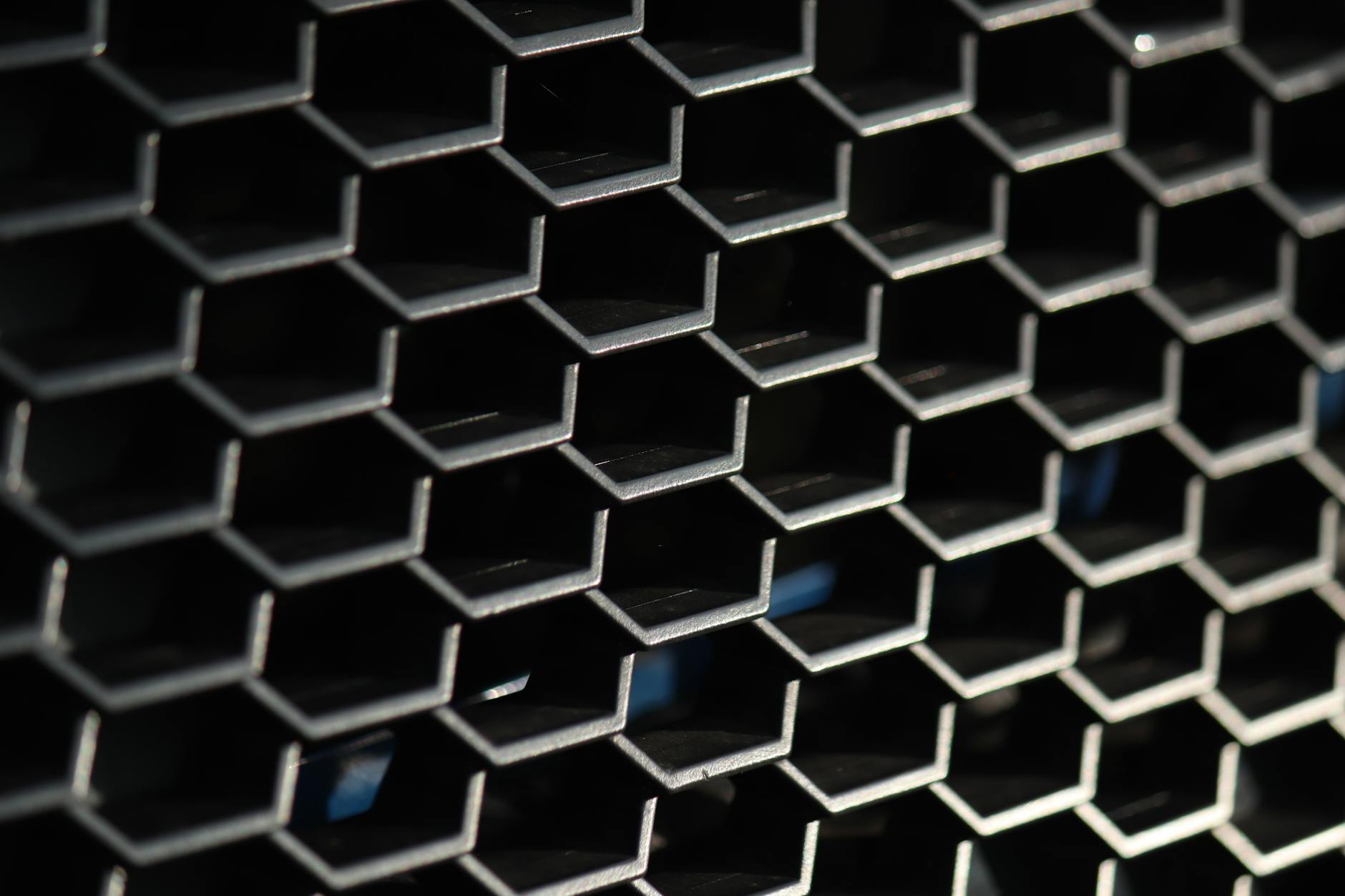 Reflective metallic surface showing chrome-like finish and shine
