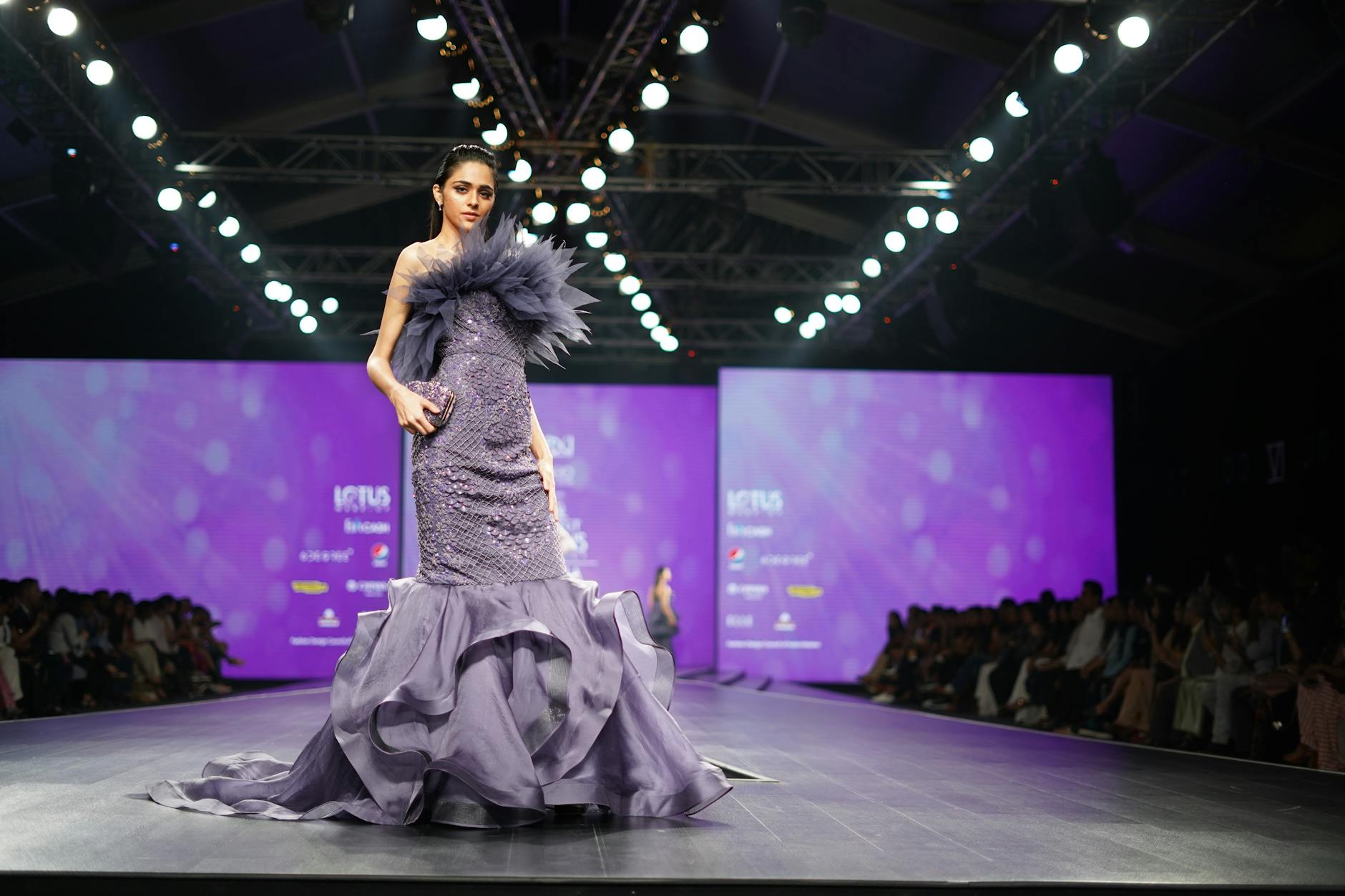 High-end fashion show with models in designer clothing
