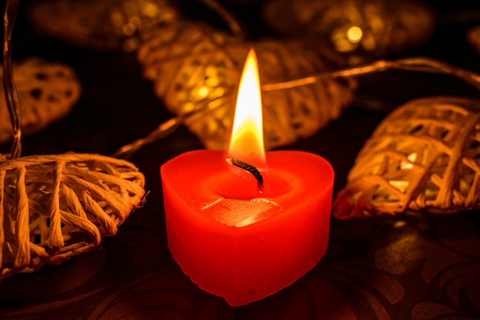 Softly lit candles creating warm atmospheric lighting representing Venus in Cancer energy