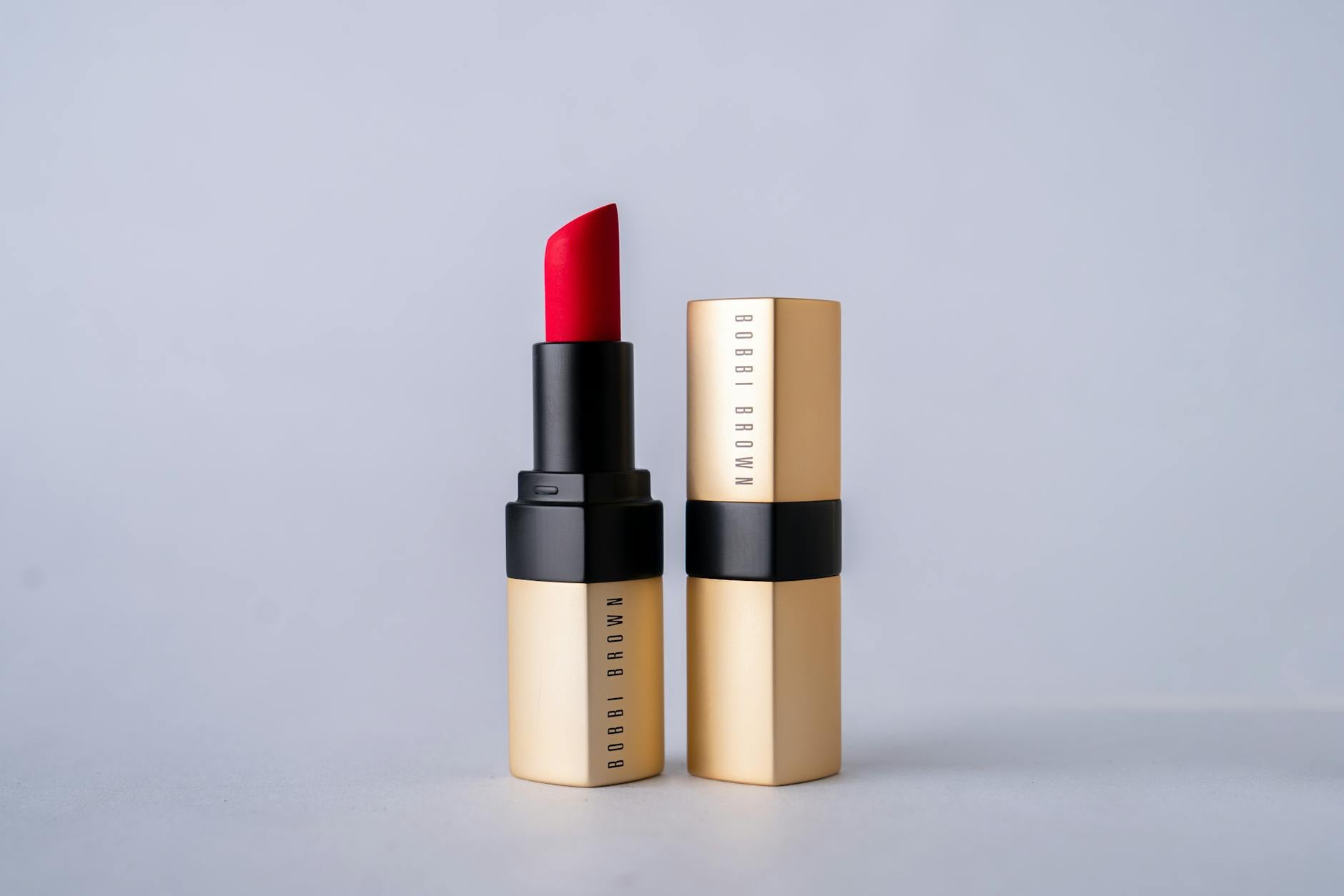 High-end lip products laid out on a marble surface