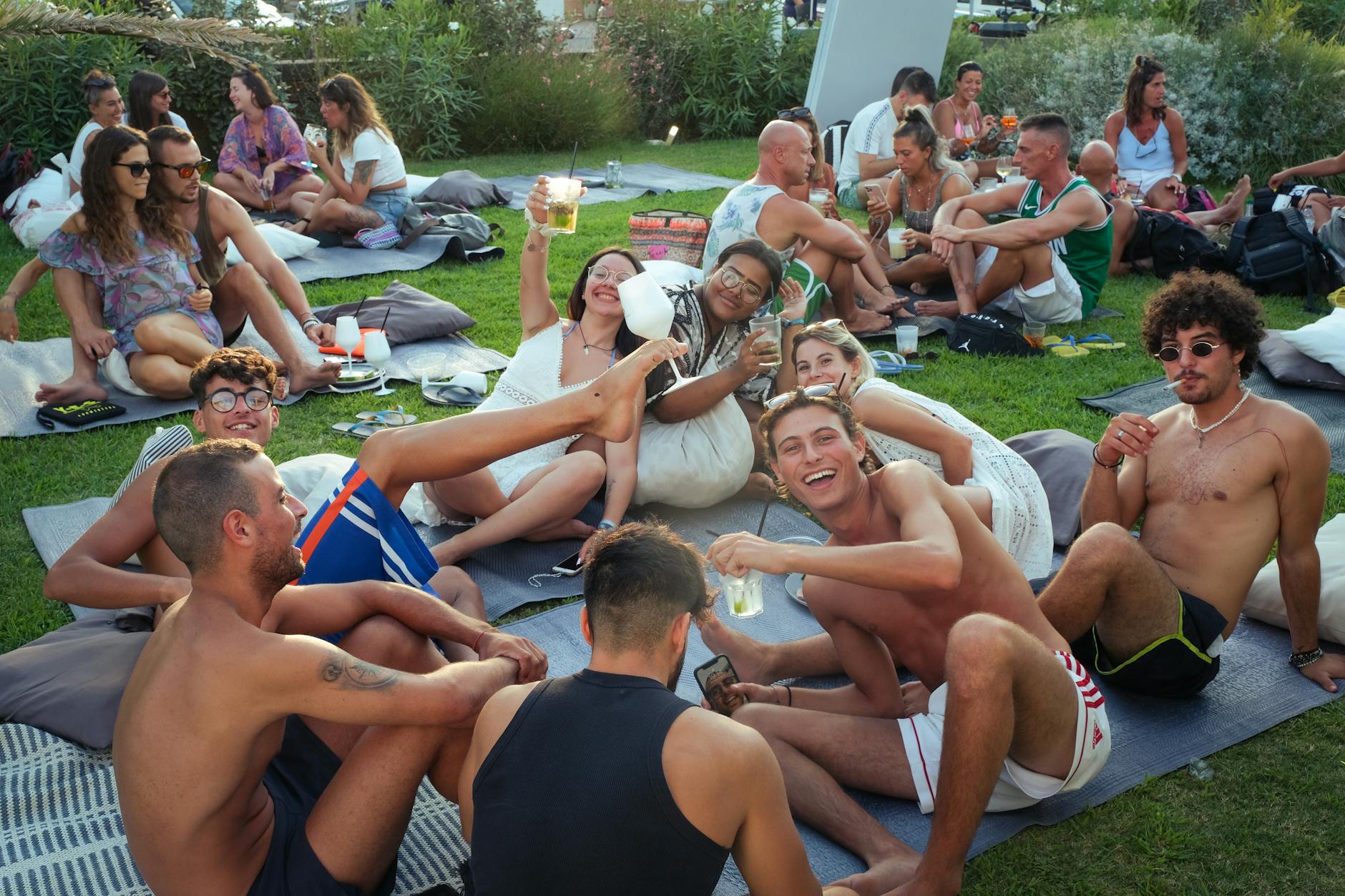 A lively summer gathering with friends socializing outdoors
