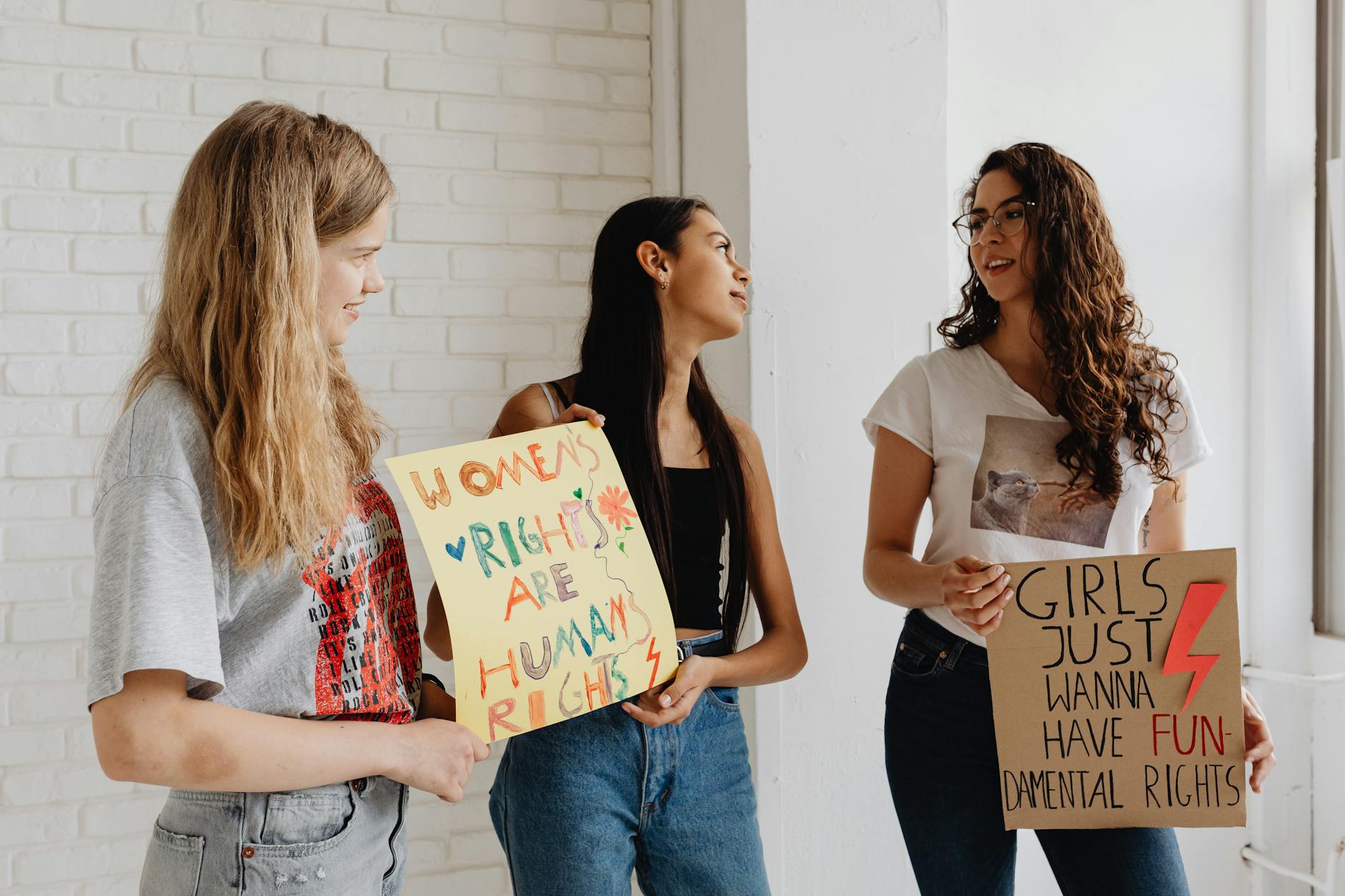 Diverse group of young women in supportive conversation and community gathering