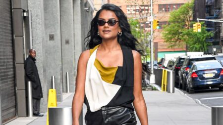 Woman wearing stylish leather jacket in natural lighting