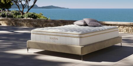 Modern bedroom with white mattress and neutral bedding