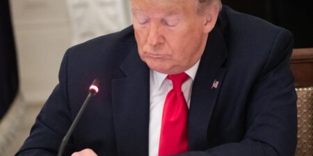 Trump Post Verification Becomes Essential Digital Skill Person holding smartphone displaying social media feed
